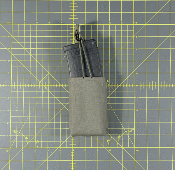 Ranger Green 5.56 magazine pouch displayed in our tac gear shop. Shown with AR15 magazine.