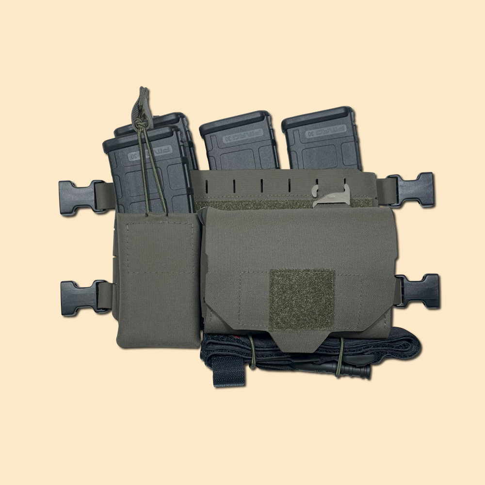 Edited - G3 Panel Loaded G3 Placard with G3 Universal Quick Detach Panel mounted. Shows 5.56 magazine pouch and Quick Access Trauma Pouch on front. Ranger Green.