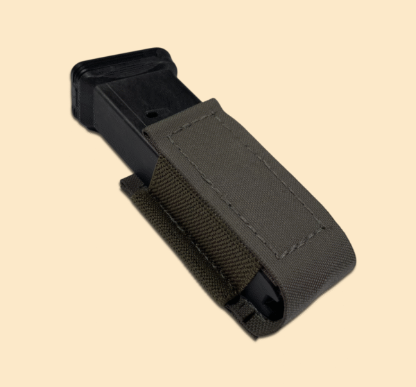 Ranger green pistol magazine pouch displayed with a pistol magazine.
