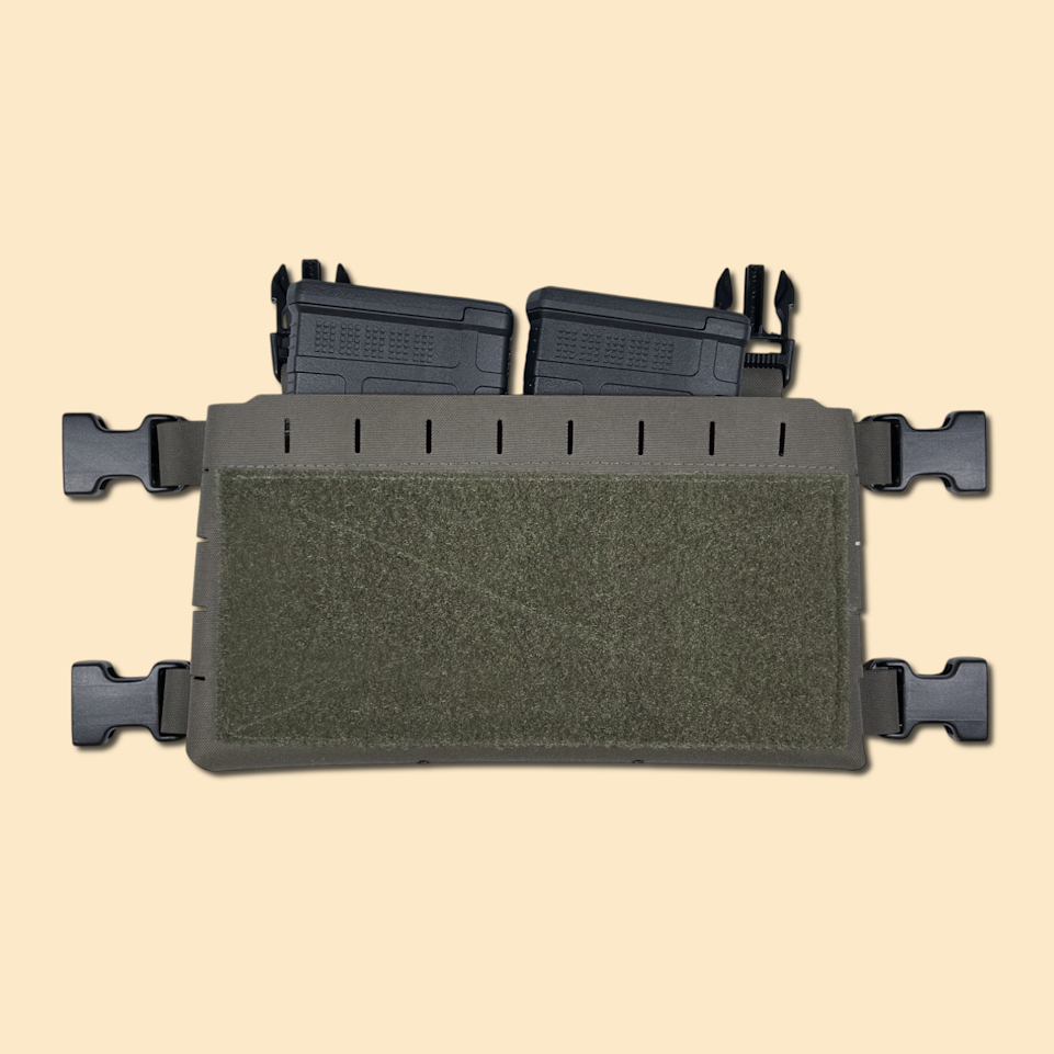 Chest rig placard in ranger green, displayed with two .308 magazines.