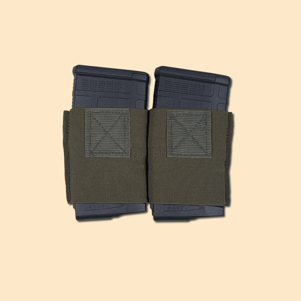 Elastic magazine insert with two 7.62 rifle magazines inserted
