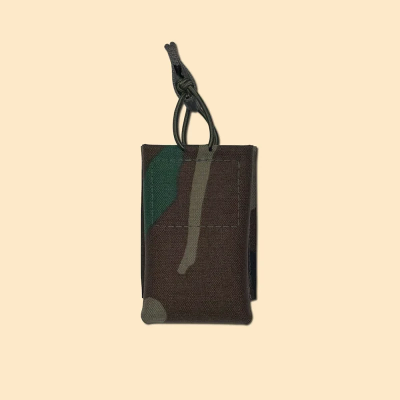 M81 woodland 5.56 rifle magazine pouch with bungee retention front view.