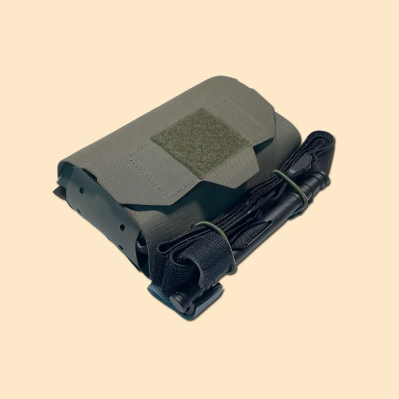 Ranger green IFAK pouch with hook and loop closure and externally mounted tourniquet